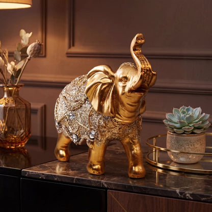 Escultura elefante da sorte dourado com suculenta e vaso decorativo