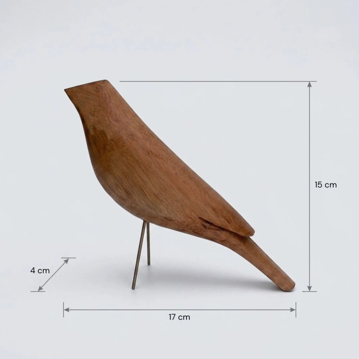 Escultura pássaro de madeira com monstera e vaso de terracota artesanal