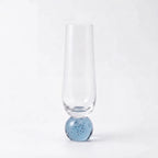 Taça champagne vidro bubble azul com base esférica em fundo branco